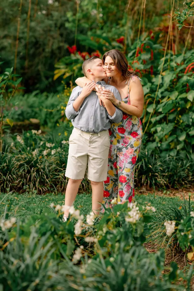 Parents and children laughing together outdoors