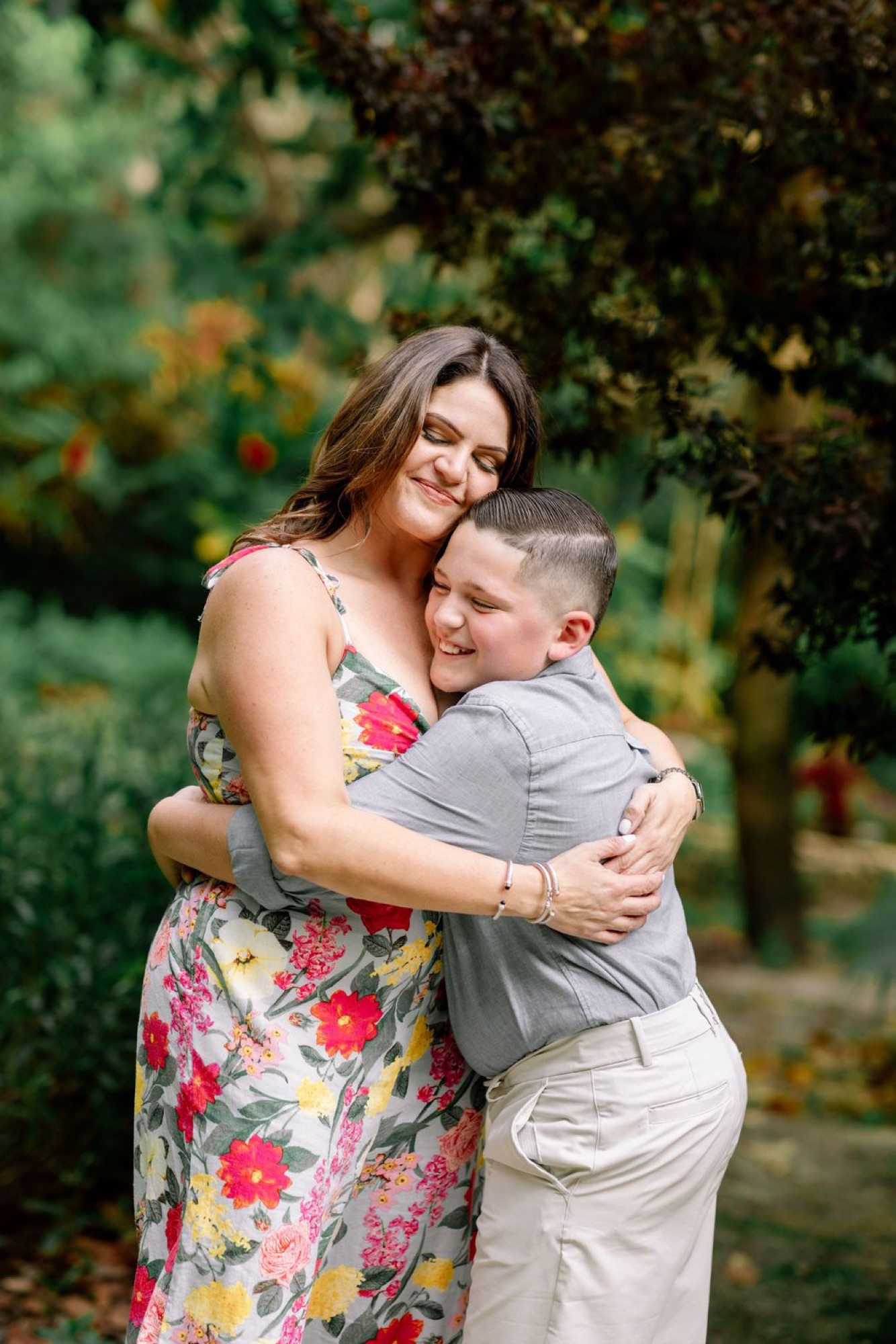 Mother and son sharing a warm embrace among the garden greenery