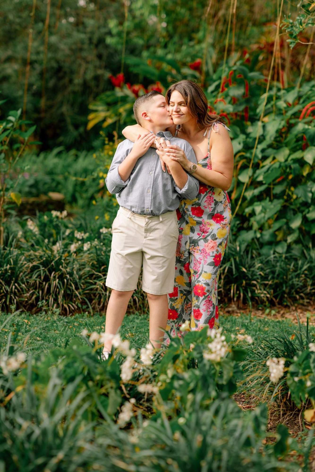 Parents and children laughing together outdoors